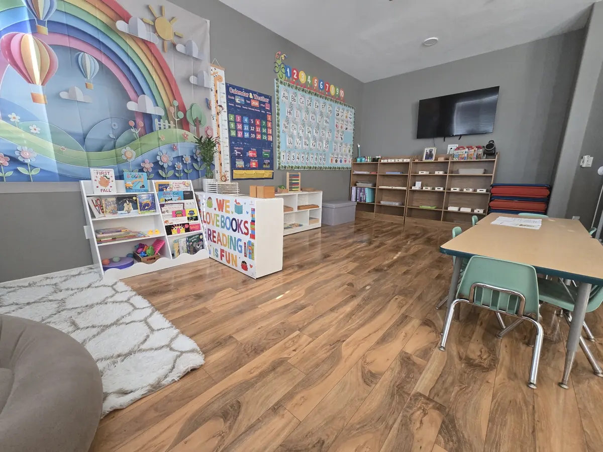 Bright Blooming Lotus classroom with learning shelves, a reading corner and child-sized tables